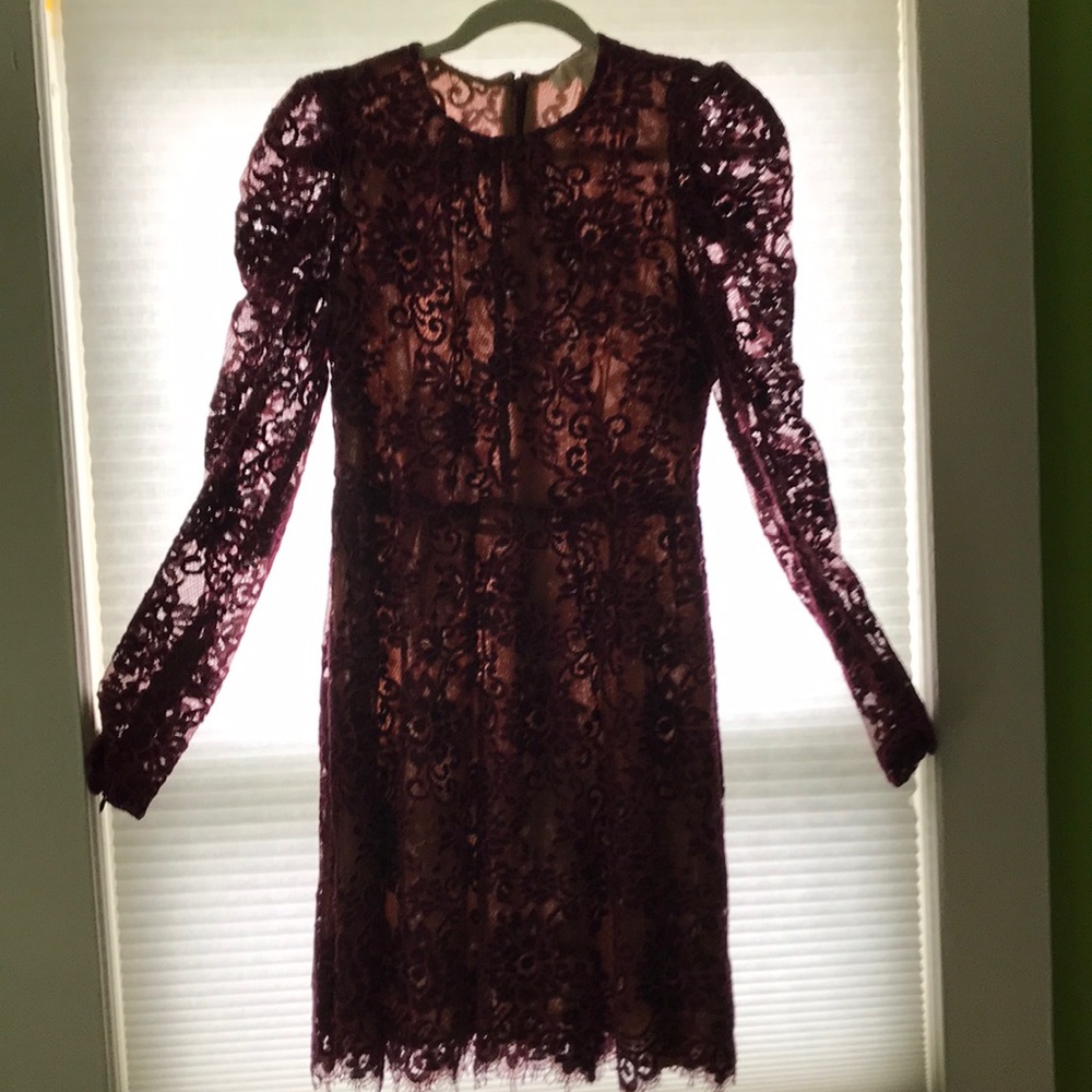 This is a Michael Kors,  dark purple lace size 6.